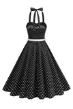 Prickiga halter svart A-linje 1950-talsklänning med rosett