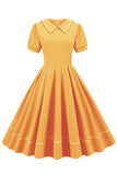 Retro stil blå 1950 -talsklänning med korta ärmar